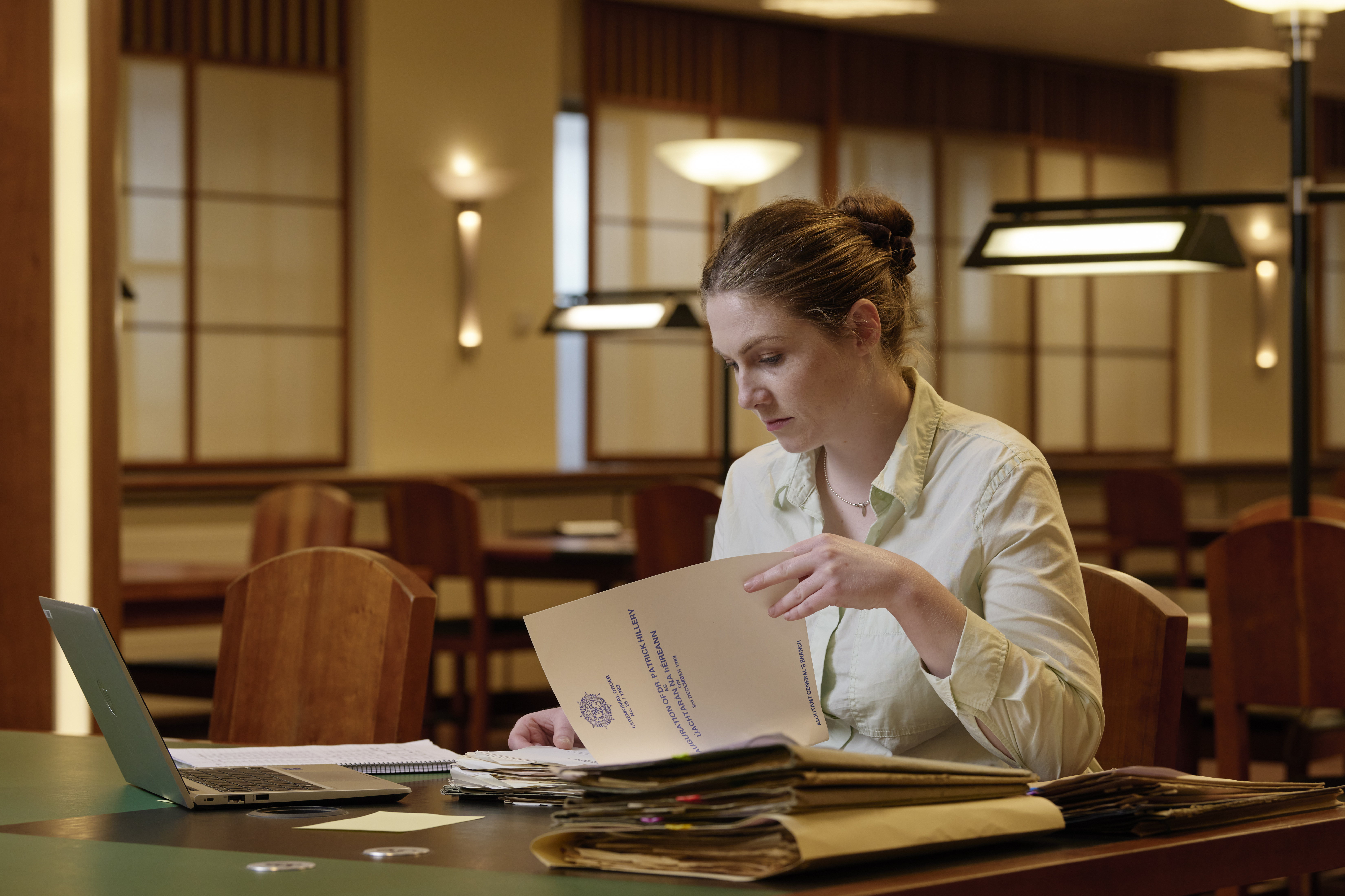 A woman researching documents in the National Archives