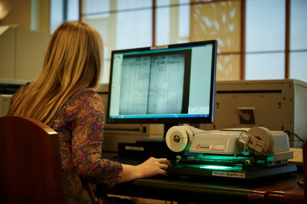 Woman researching on computer