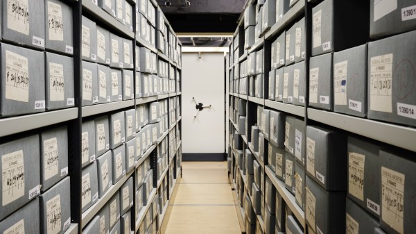 An aisle containing documents on shelves