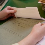 A researcher reading some documents related to the Department of the Taoisigh