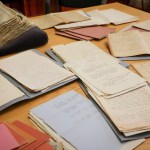 Collection of archival documents on a table